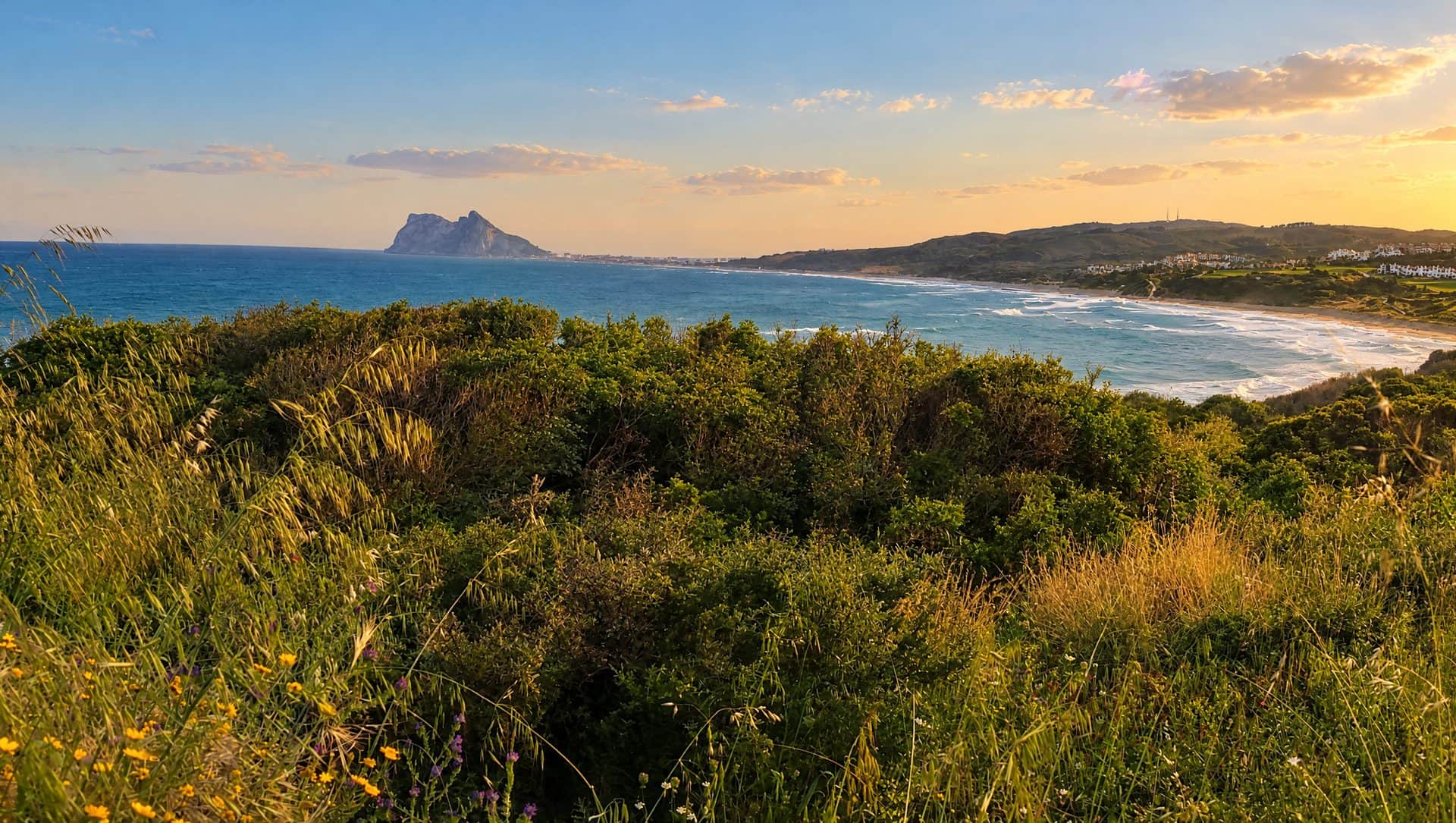 View from the Alcaidesa headland over the bay and golf course to the Rock of Gibraltar